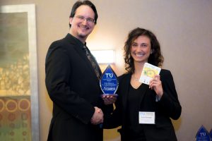TRU's Kelly Logan congratulates Jeri Stroupe of WSU Economic Development, Exemplary Innovation Awardee