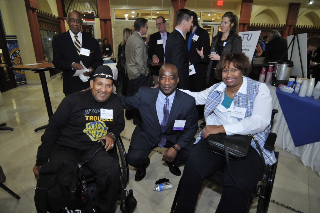 RTA CEO Michael Ford (center) with Warriors on Wheels members Larry Dilworth (left) and Lisa Franklin (right)