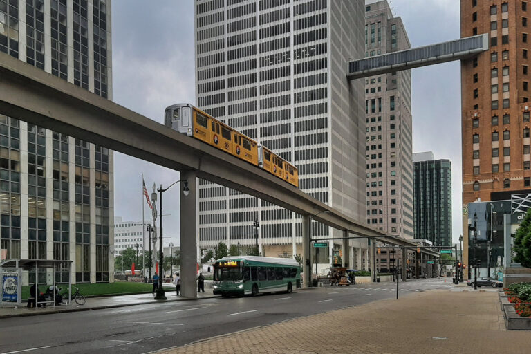 People Mover over a DDOT bus in downtown