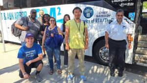 Happy people leaving Ann Arbor back to Detroit in front of the D2A2 bus.