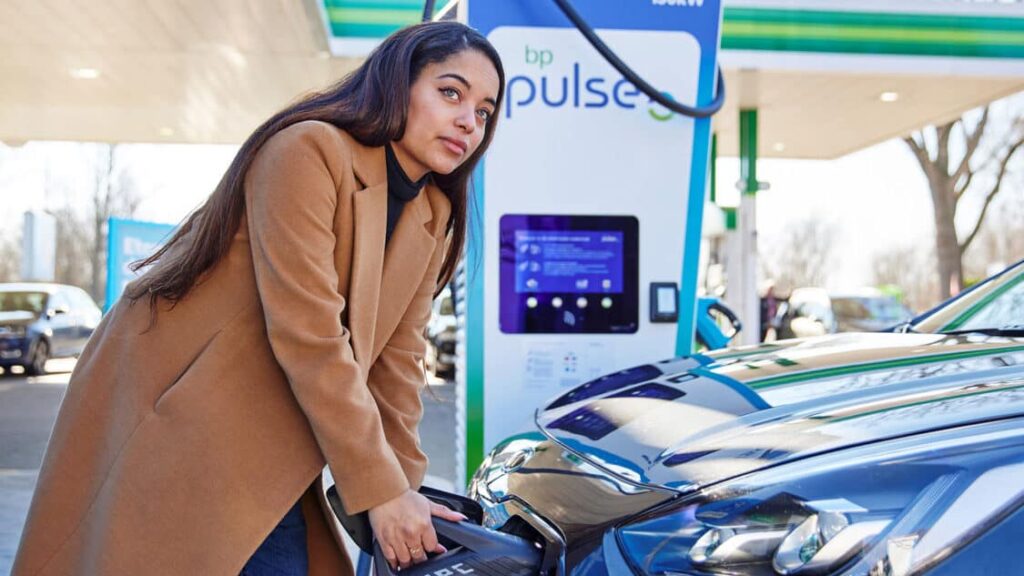 Woman charging EV