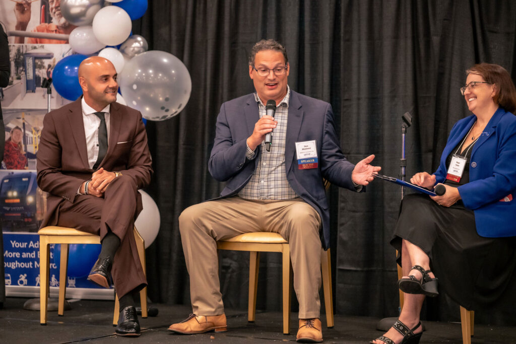 Assad Turfe and David Woodward speaking with Megan