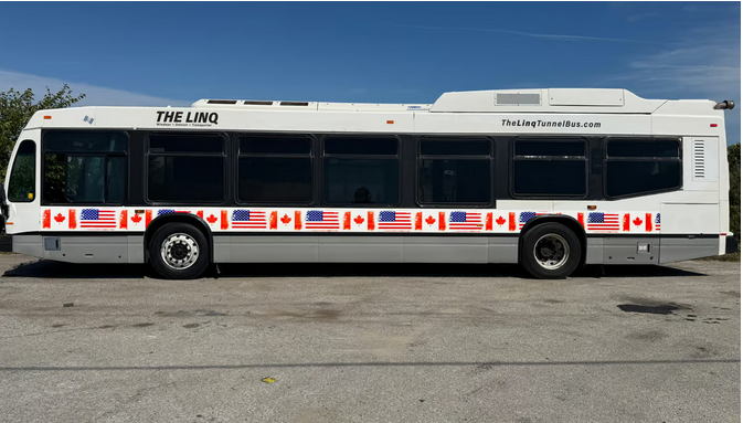 The Linq Tunnel Bus vehicle, wrapped in US and Canadian flags