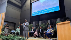 Mayoral candidates speaking on stage, at the Detroit transit mayoral forum