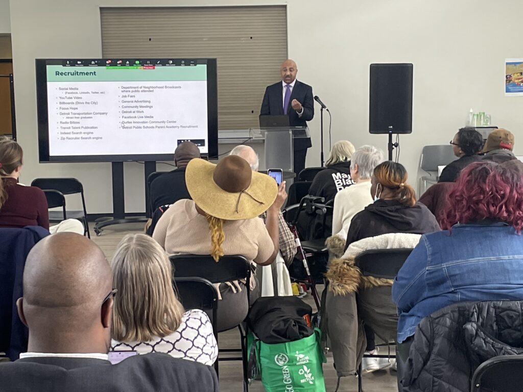 DDOT representative presents DDOT recruitment data to a crowd of the public